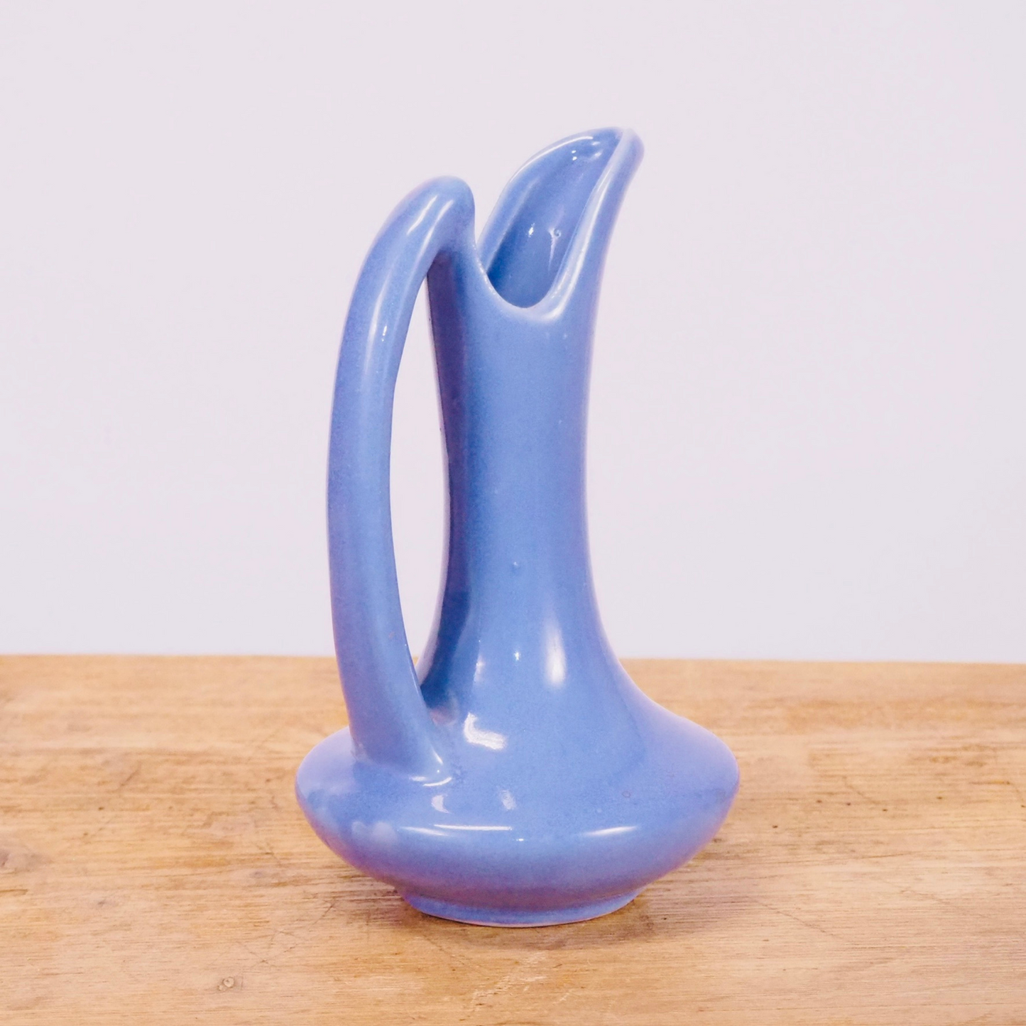 Periwinkle purple ceramic small flower bud vase pitcher.