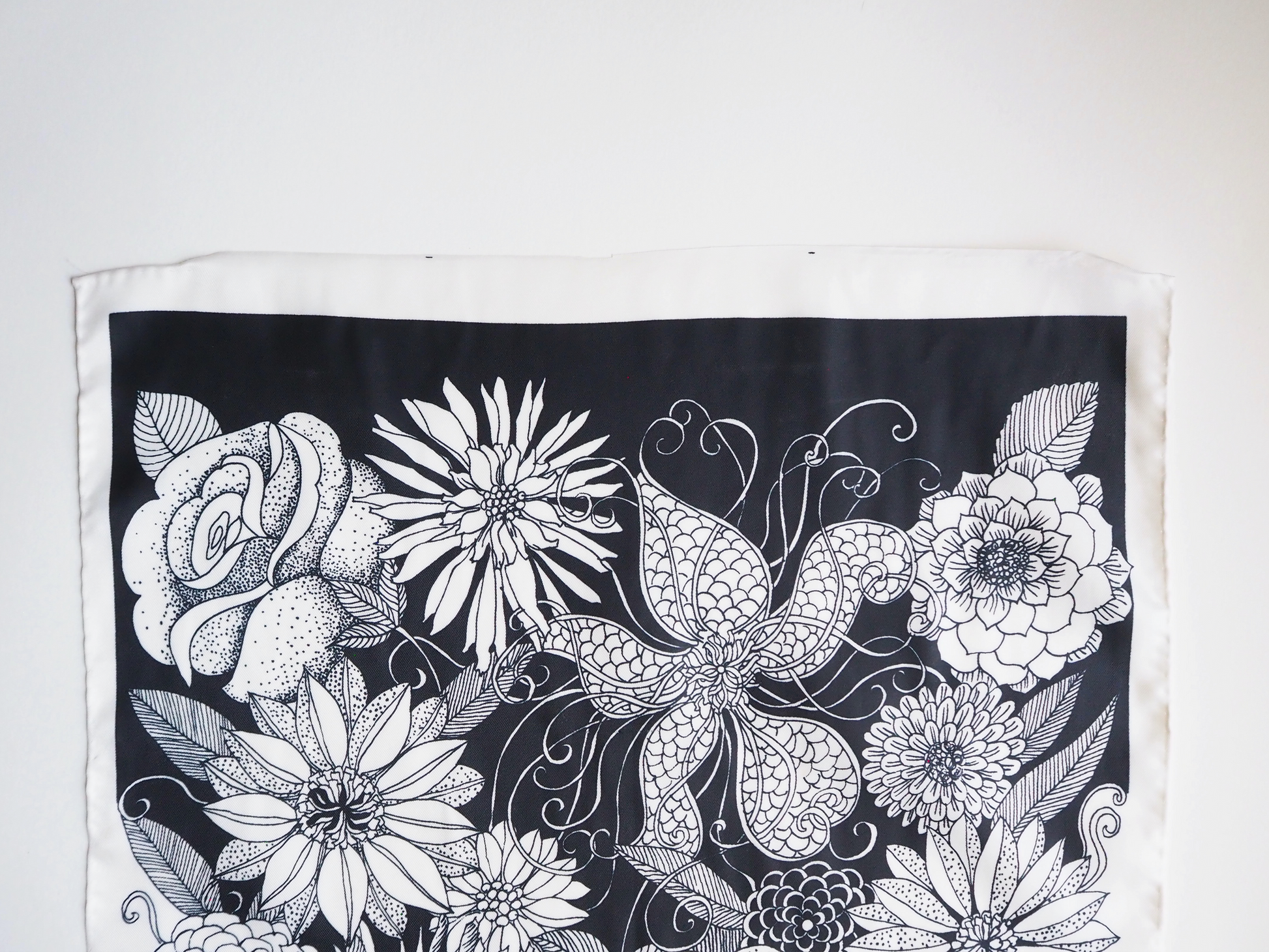 Vintage scarf with a black and white floral print swirled together.