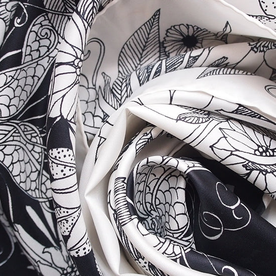 Vintage scarf with a black and white floral print swirled together.