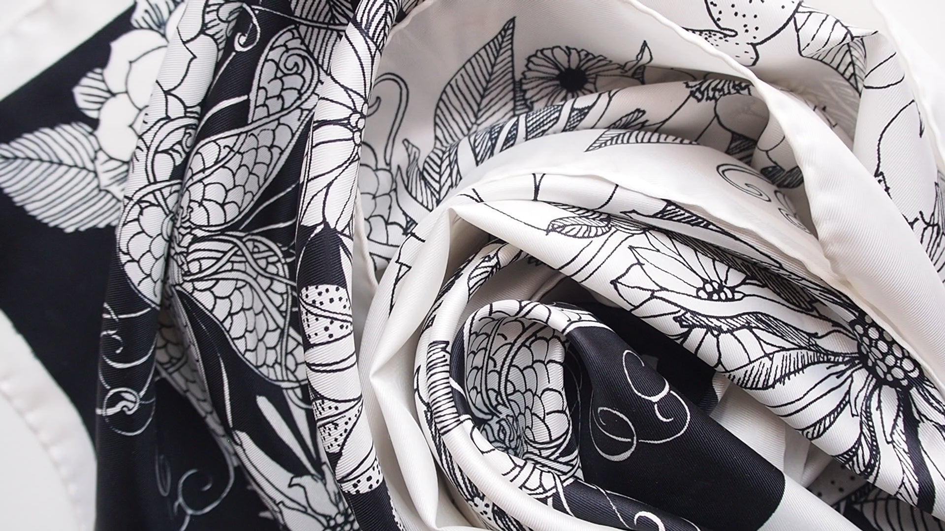 Vintage scarf with a black and white floral print swirled together.