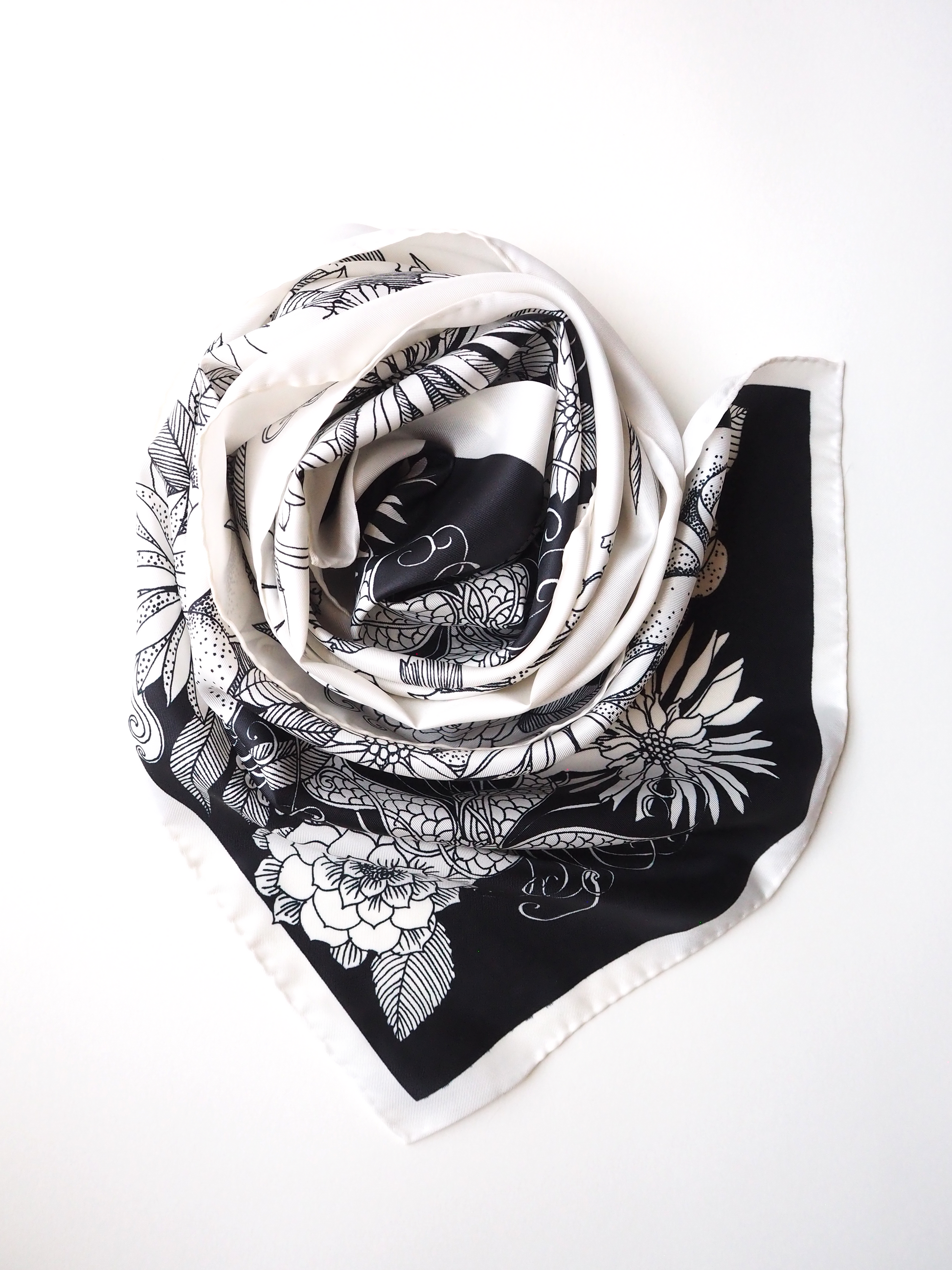 Vintage scarf with a black and white floral print swirled together.