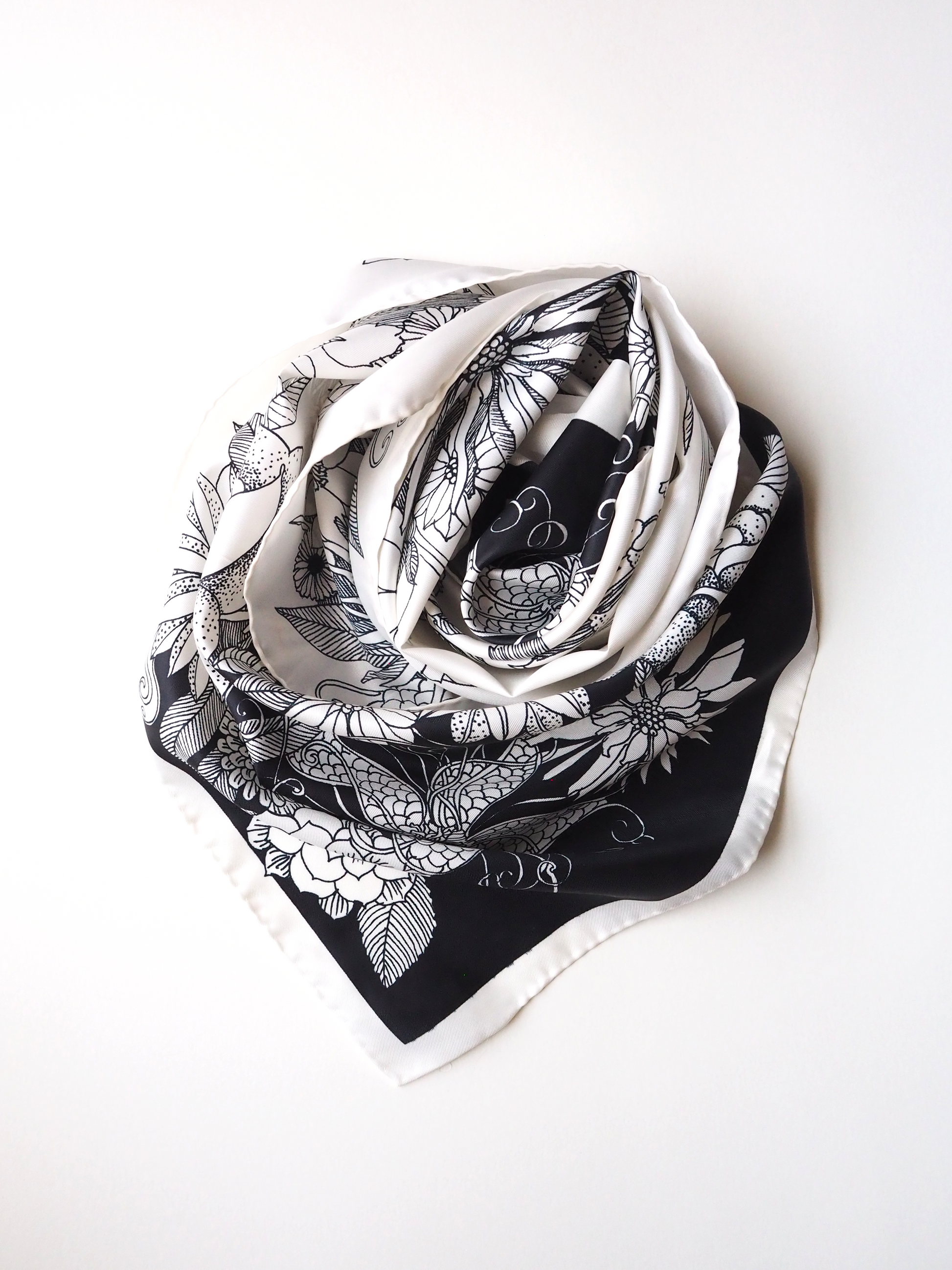 Vintage scarf with a black and white floral print swirled together.