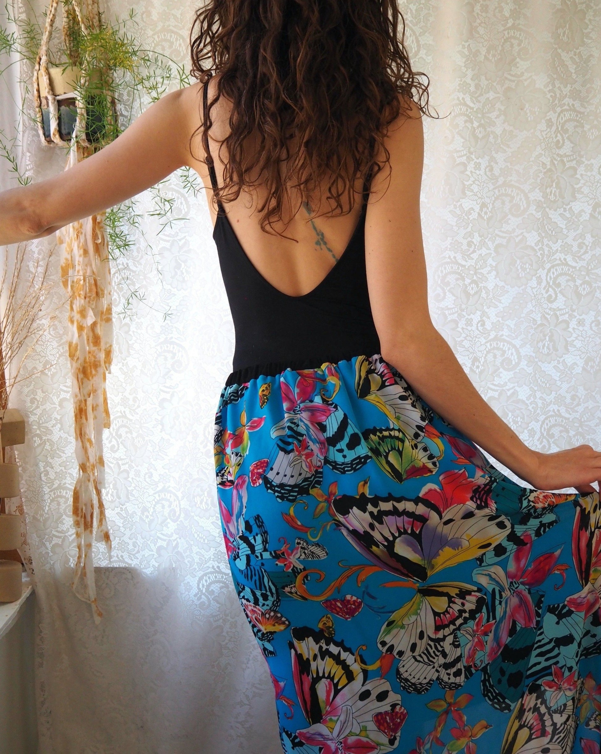 Abstract butterfly print, mermaid cut skirt by Nicole Miller. Back