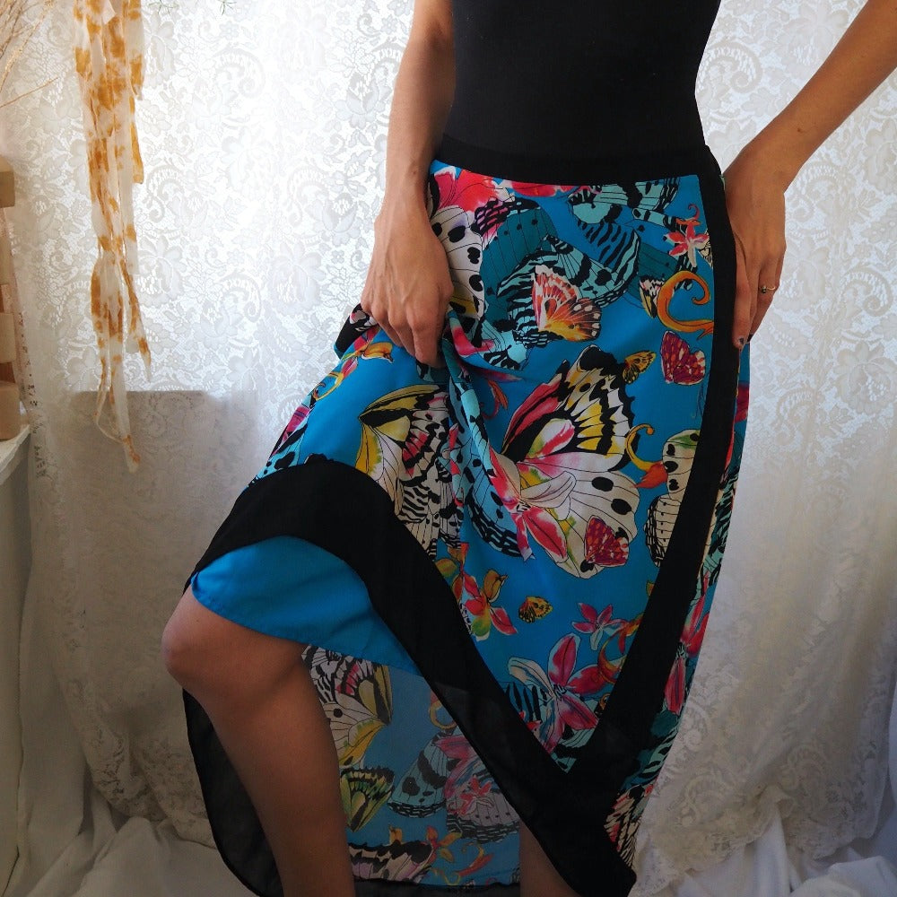 Abstract butterfly print, mermaid cut skirt by Nicole Miller. Slip liner.