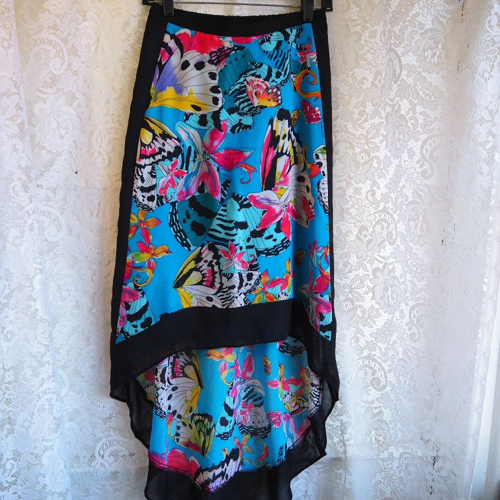 Abstract butterfly print, mermaid cut skirt by Nicole Miller. Front on hanger.